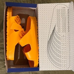 Brand new, in box, never worn orange Birkenstocks
